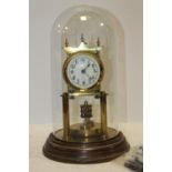 A GLASS DOME TOP BRASS MANTEL CLOCK