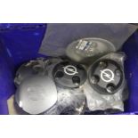 A BOX OF VARIOUS CAR WHEEL DISKS MAINLY VAUXHALL AND OPAL