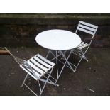 A BISTRO TABLE AND 2 FOLDING CHAIRS