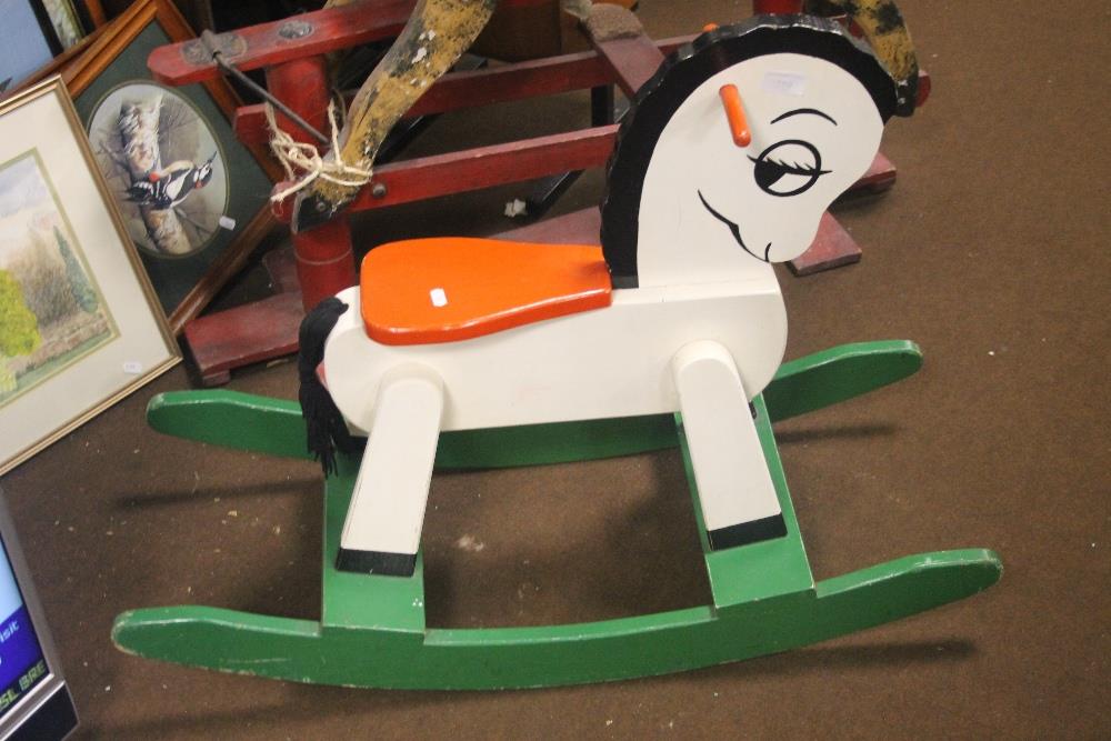 A WOODEN CHILD'S ROCKING HORSE