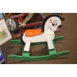 A WOODEN CHILD'S ROCKING HORSE