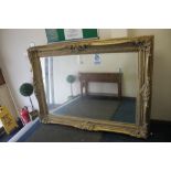 A VERY LARGE GILT MIRROR 185 CM X 136 CM