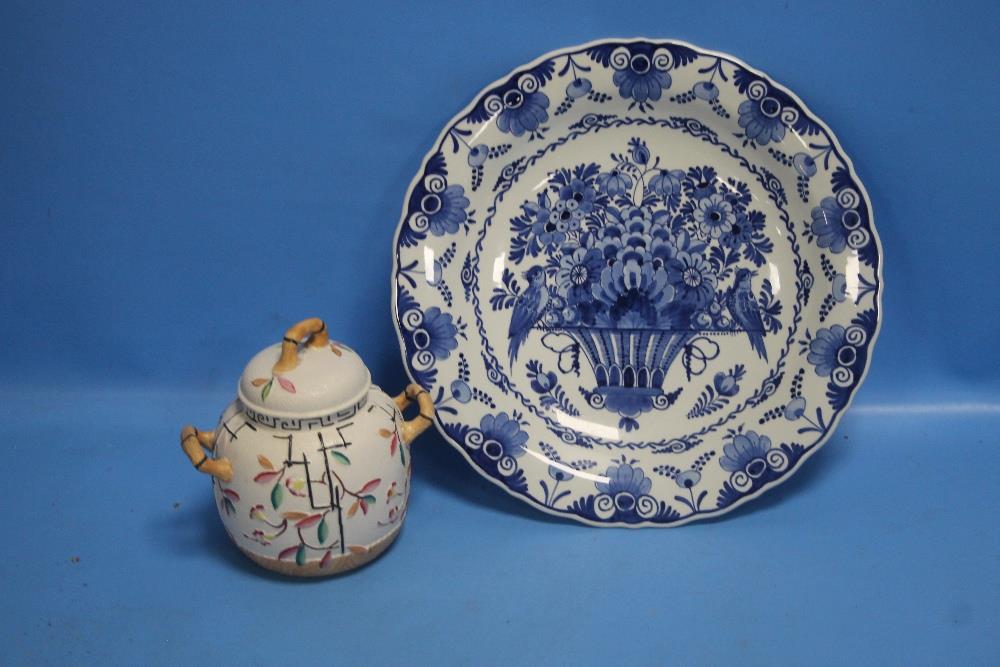 A DELFT BLUE AND WHITE PLATE TOGETHER WITH A TWIN HANDLED LIDDED POT