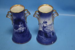 A PAIR OF ANTIQUE VASES DECORATED WITH CHILDREN