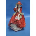 A ROYAL DOULTON FIGURINE "TOP O' THE HILL"