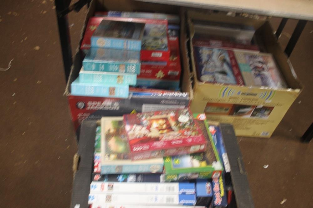 A LARGE QUANTITY OF JIGSAW PUZZLES