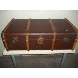 A BROWN WOODEN BRANDED TRAVEL TRUNK WITH INNER TRAY