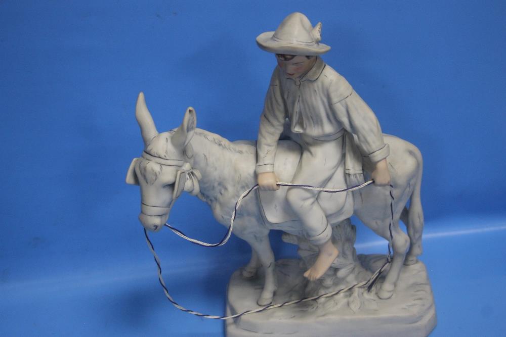 A ROYAL DUX FIGURE OF A BOY ON A HORSE