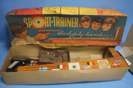 A VINTAGE BOXED SPORT TRAINER, PARTS NOT CHECKED