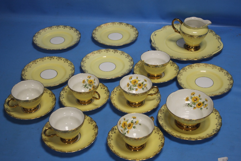 A YELLOW PATTERNED TEA SET