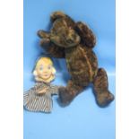 A VINTAGE JOINTED TEDDY BEAR AND A FINGER PUPPET