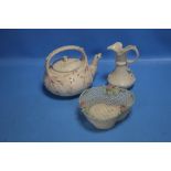 A BELLEEK TEAPOT TOGETHER WITH A JUG AND A PIERCED BASKET