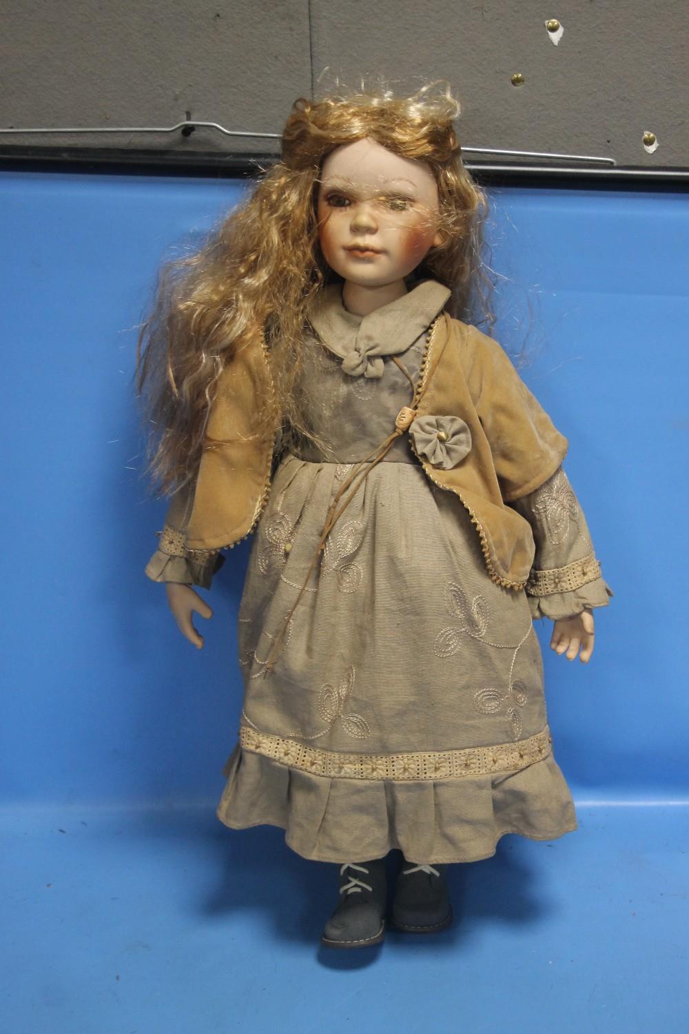 A PORCELAIN HEADED DOLL H 68CM