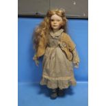 A PORCELAIN HEADED DOLL H 68CM