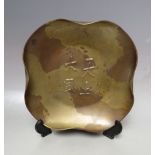 A SHAPED BRONZED METAL DISH WITH ORIENTAL CHARACTER MARK EMBELLISHMENT, approx Dia. 23 cm