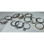 A COLLECTION OF TWELVE SILVER AND CZ DRESS RINGS, mostly QVC Diamonique examples. various designs