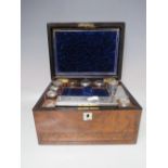 AN ANTIQUE BURR WALNUT DRESSING TABLE BOX, the hinged lid opening to reveal fitted interior with