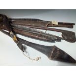 A COLLECTION OF EIGHT ASSORTED TRIBAL CLUBS, SPEARS AND A FLY WHISK, mostly with incised detail (8)