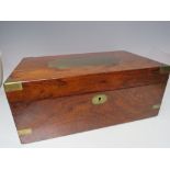 A VICTORIAN BRASS BOUND MAHOGANY WRITING SLOPE, the hinged lid opening to a leather writing surface,