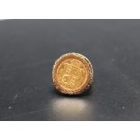 A QUEEN VICTORIA SHEILD BACK HALF SOVEREIGN DATED 1892, in an ornate pierced ring mount, approx