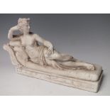 A WHITE BISQUE FIGURE OF VENERA VIKTRIS, semi nude lying on a chaise longue, W 25 cm