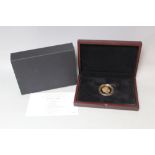 A CASED LIMITED EDITION GUERNSEY 916 GOLD PROOF FIVE POUND HARRY AND MEGAN ROYAL WEDDING COIN,