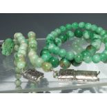 A VINTAGE SILVER AND JADEITE RING, together with a vintage jade type bead necklace having white