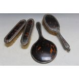 A MATCHED FOUR PIECE HALLMARKED SILVER AND TORTOISESHELL DRESSING TABLE SET, various dates and