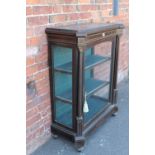 A VICTORIAN EBONISED PIER CABINET, having single glazed door, gilt metal beaded detail, small