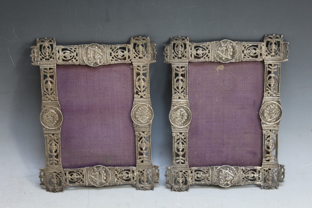 AN UNUSUAL PAIR OF ASIAN PIERCED WHITE METAL WALL HANGING PHOTO FRAMES, appear to be inset with