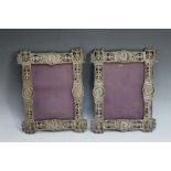 AN UNUSUAL PAIR OF ASIAN PIERCED WHITE METAL WALL HANGING PHOTO FRAMES, appear to be inset with