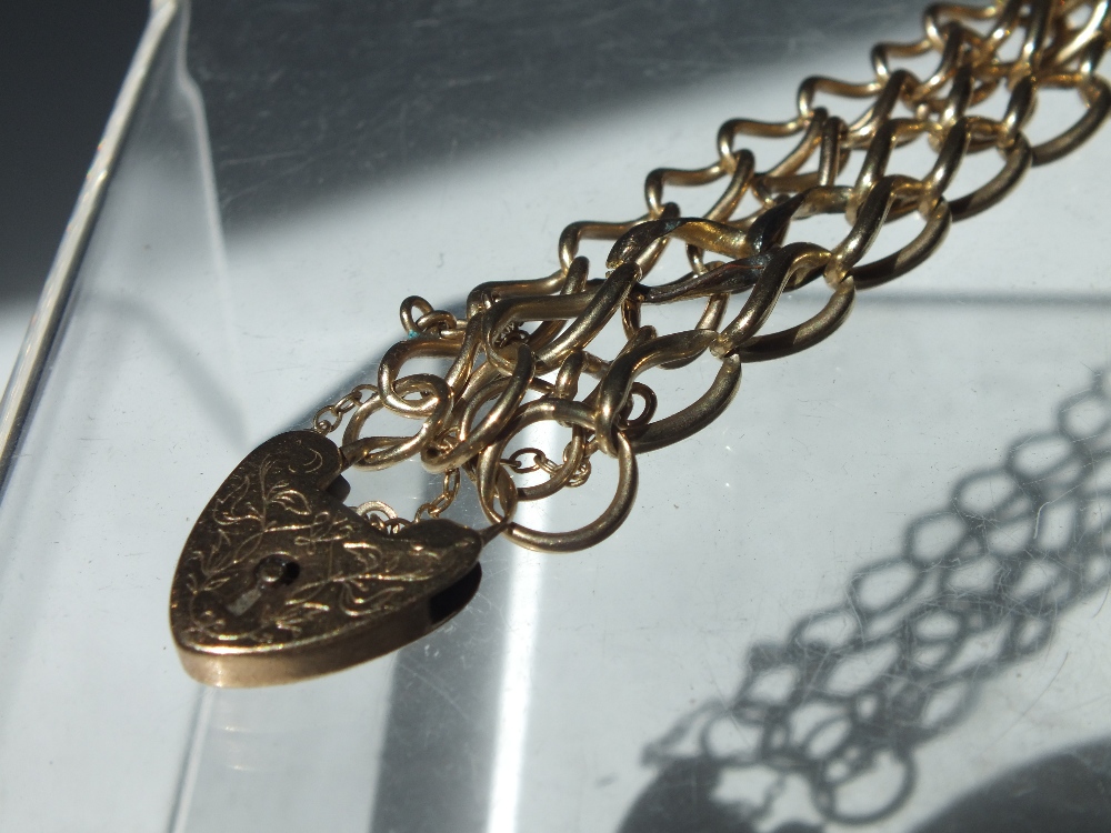 A HALLMARKED 9CT GOLD DOUBLE ROW CHAIN LINK STYLE BRACELET, with engraved heart clasp and safety