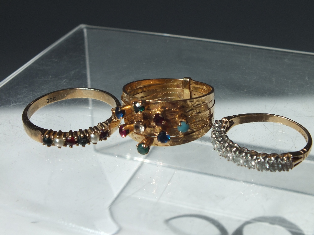 A 9CT GOLD AND CUBIC ZIRCONIA ETERNITY STYLE RING, together with a 9ct gold band set with six