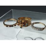 A 9CT GOLD AND CUBIC ZIRCONIA ETERNITY STYLE RING, together with a 9ct gold band set with six