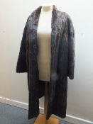A LADIES VINTAGE RICH MAHOGANY BROWN FUR COAT, possibly ermine, fully lined, front hook fastening