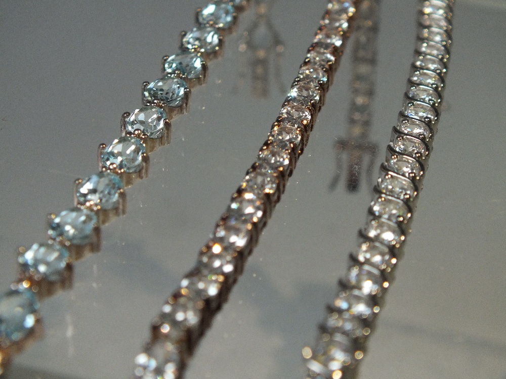 THREE MODERN GEMSET SILVER TENNIS BRACELETS, to include a QVC Diamonique example, longest L 20.5 cm