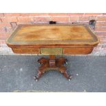 A 19TH CENTURY ROSEWOOD FOLD OVER CARD TABLE WITH INLAID BRASS DETAIL, raised on a squared column, W