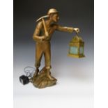 A LARGE SPELTER FIGURE OF A MINER WITH LAMP, the lamp fitted with later LED bulb, H 53 cmCondition