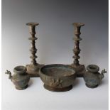 A PAIR OF EASTERN CAST CANDLESTICKS, decorated with embossed scrolling detail, H 24 cm, together