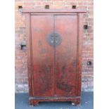 A 20TH CENTURY CHINESE STYLE TWO DOOR CABINET, red lacquered landscape detail to the front, H 176.