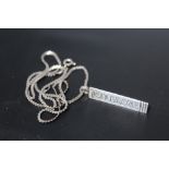 A NOVELTY HALLMARKED SILVER PENDANT IN THE FORM OF A TOBLERONE CHOCOLATE BAR, on a 925 silver chain,
