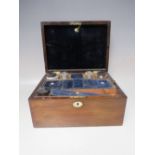 A VICTORIAN ROSEWOOD DRESSING BOX, the hinged lid with mother of pearl inlay, opening to a fitted