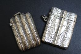 A HALLMARKED SILVER VESTA CASE IN THE FORM OF A FOUR SECTION CIGAR CASE, hallmarks indistinct but