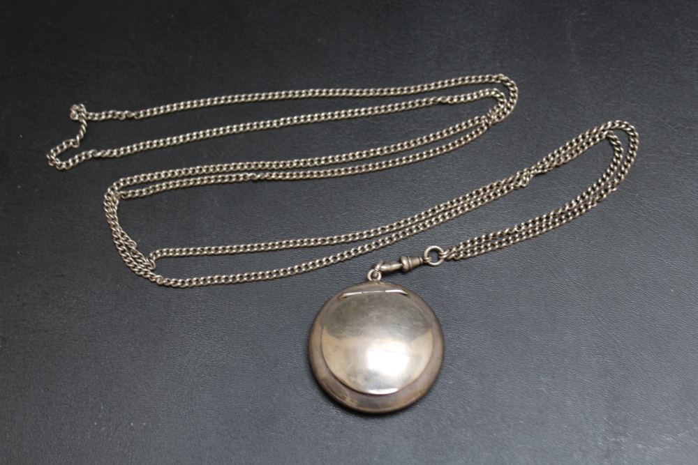 A HALLMARKED SILVER PENDANT MIRRORED COMPACT BY ZIMMERMANN, with powder puff, on unmarked white