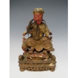 A CHINESE POLYCHROME PAINTED CARVED WOODEN TEMPLE DEITY, possibly 18th / 19th century, approx 23 x