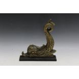 A GILT METAL DOOR STOP IN THE FORM OF A DOLPHIN, H 30 cm