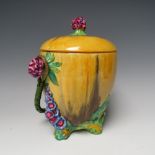 A CLARICE CLIFF MY GARDEN PATTERN BISCUIT BARREL, circa 1934, of ovoid form with relief moulded