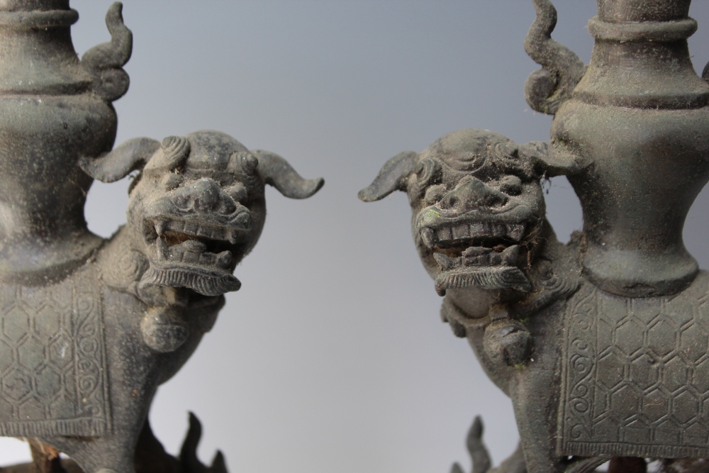 A PAIR OF 19TH CENTURY CAST BRONZE FOO DOG STANDS, each raised on three scrolling feet with foo - Image 2 of 6