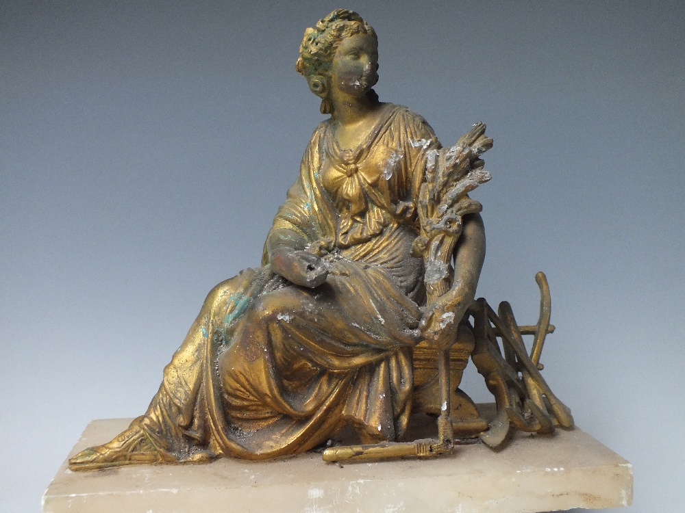 A GILDED SPELTER FIGURINE OF HARVEST, probably from a French clock, set on a alabaster base, H 22