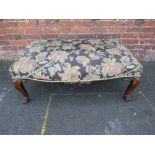 A LARGE 19TH CENTURY ROSEWOOD UPHOLSTERED STOOL, having floral upholstery, raised on four carved